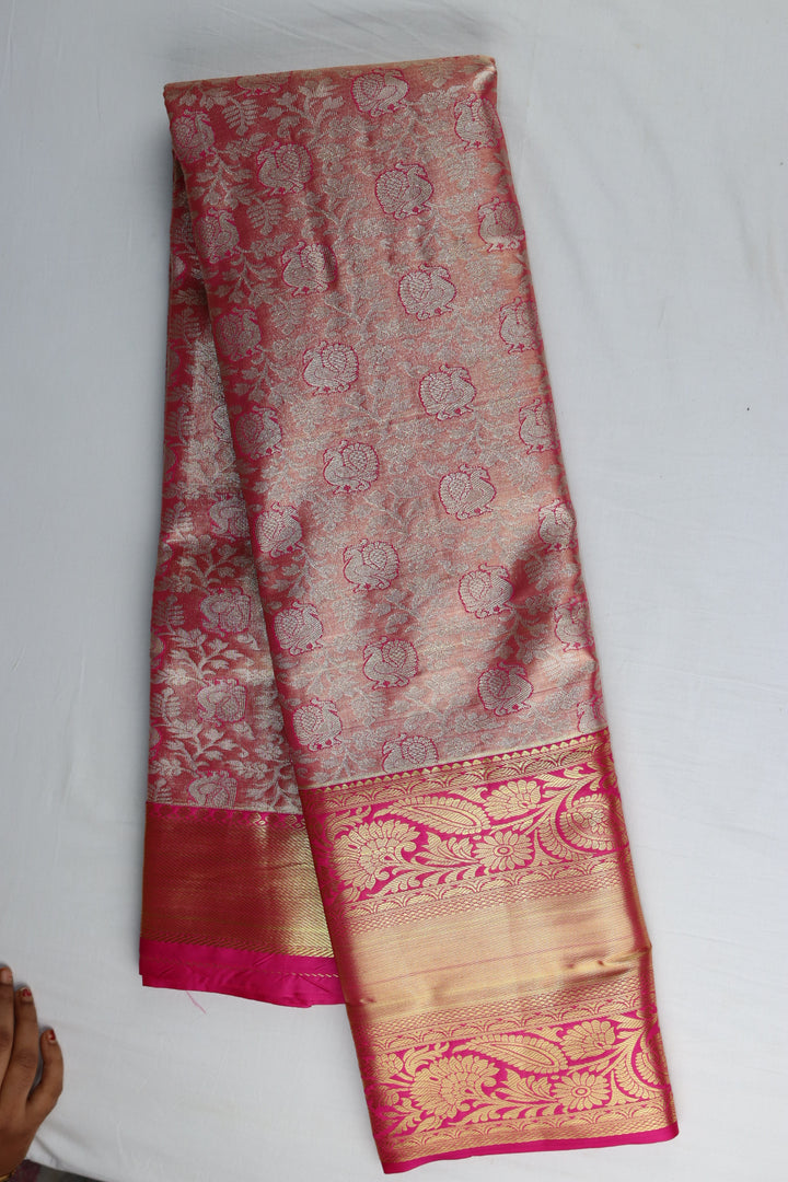 Graceful Peach Tissue Kanjipuram Saree